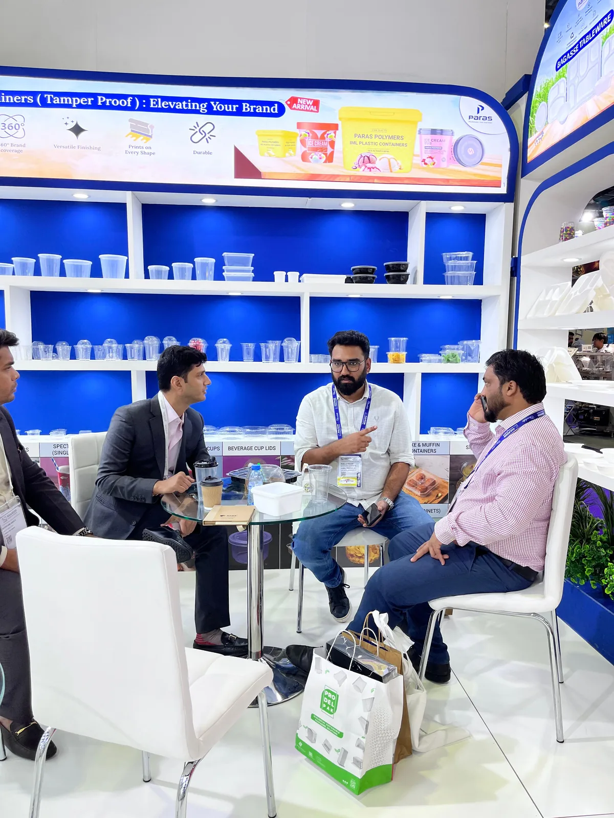 Buyer conversation inside the Paras booth in Dubai